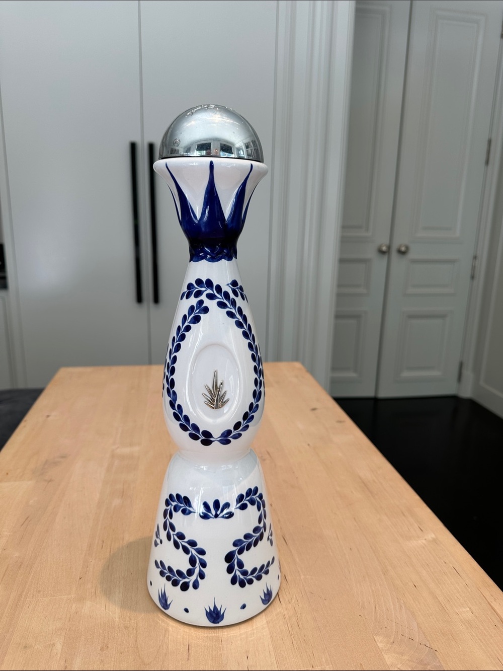 Blue and White Ceramic Decorative Pedestal with Silver Orb Accent